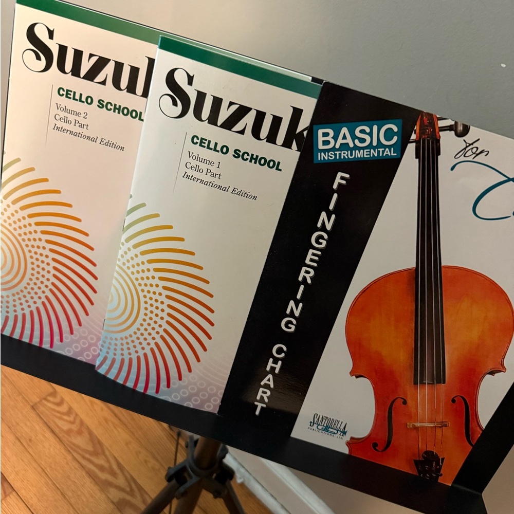 Lot of cello books, music stand, cello foot stopper